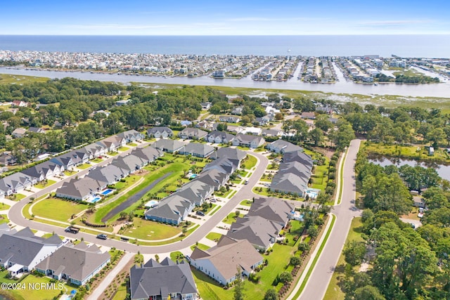 drone / aerial view with a water view