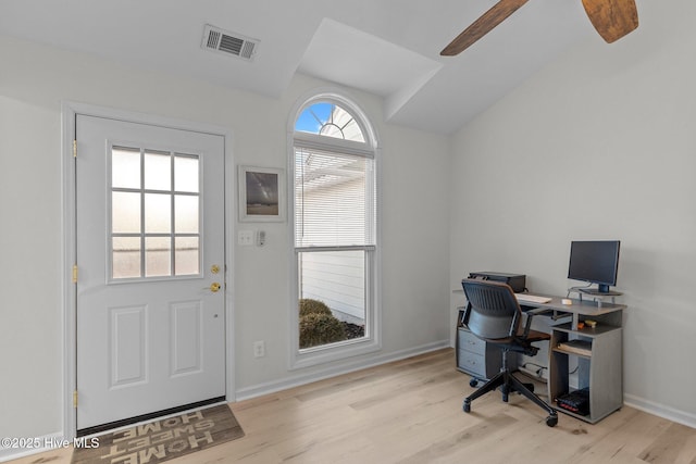 office with light hardwood / wood-style flooring and ceiling fan