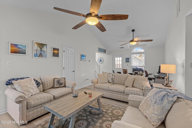 living room featuring high vaulted ceiling