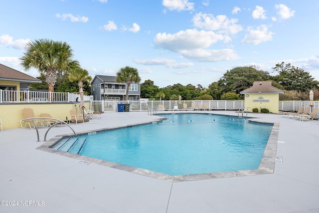 view of pool featuring a patio