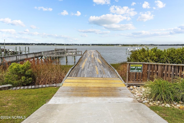 dock area with a water view