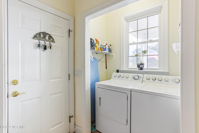 clothes washing area featuring washing machine and dryer