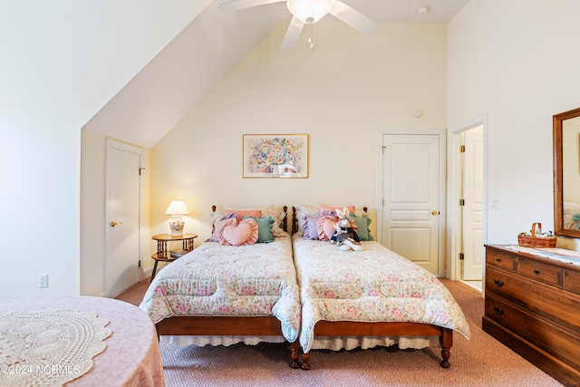 bedroom with high vaulted ceiling, ceiling fan, and carpet