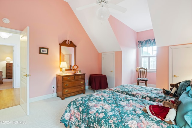 carpeted bedroom featuring lofted ceiling and ceiling fan