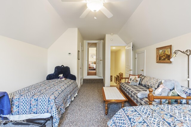 bedroom with carpet flooring, ceiling fan, and vaulted ceiling