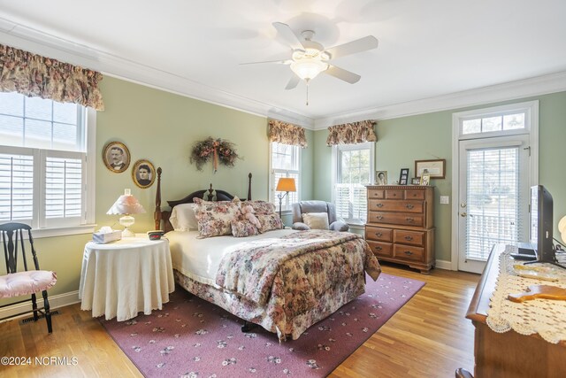 bedroom with light wood-type flooring, multiple windows, access to outside, and ceiling fan