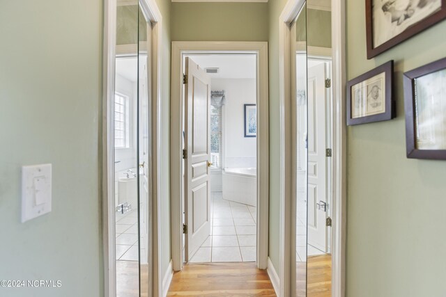 hall with light hardwood / wood-style floors