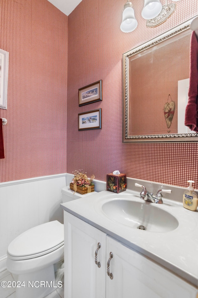 bathroom with toilet and vanity