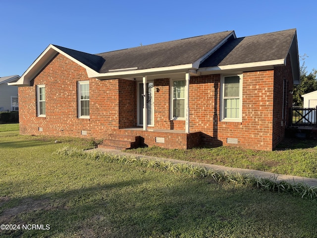 single story home with a front yard