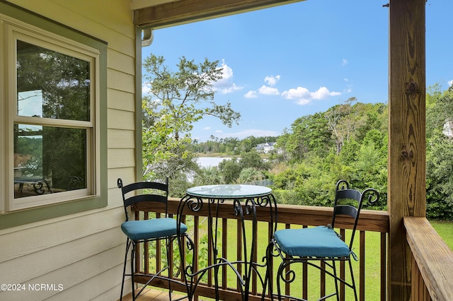 balcony featuring a water view