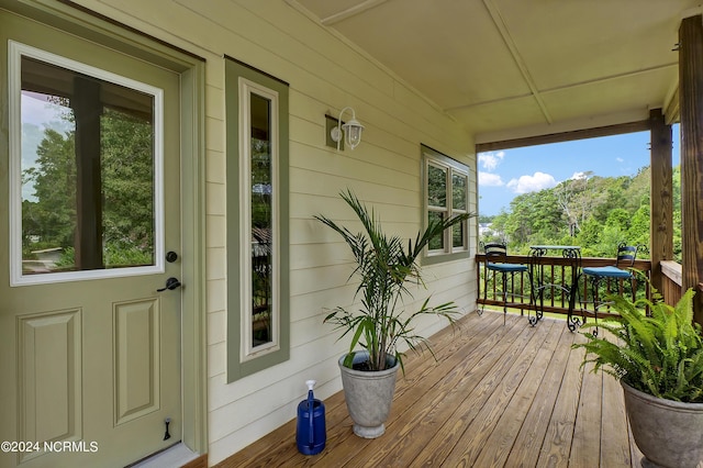 wooden terrace with covered porch