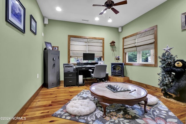 office space featuring recessed lighting, light wood-style floors, visible vents, and baseboards