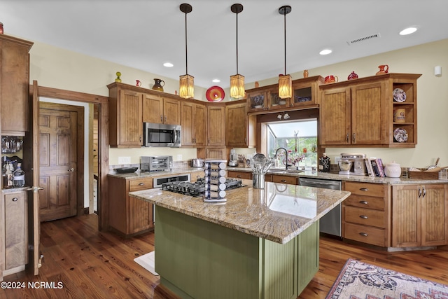 kitchen with open shelves, a toaster, dark wood-style flooring, appliances with stainless steel finishes, and decorative light fixtures