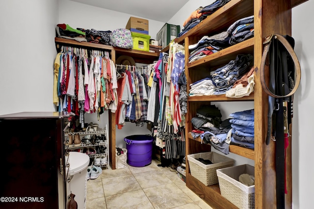 spacious closet featuring tile patterned floors