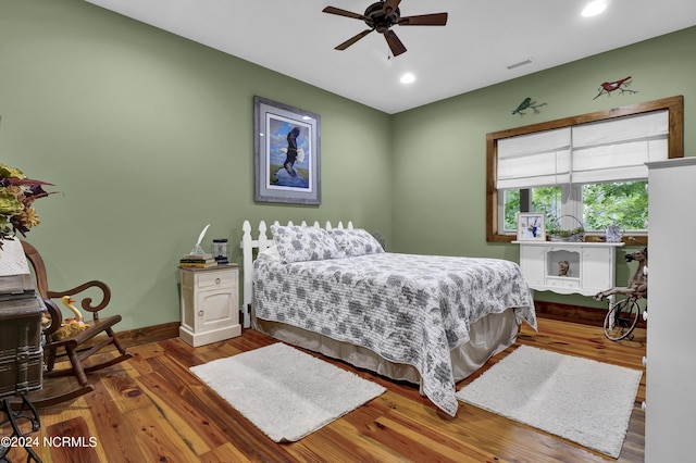 bedroom with wood finished floors, visible vents, baseboards, recessed lighting, and ceiling fan