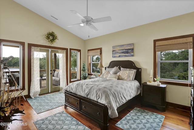 bedroom featuring access to outside, multiple windows, and visible vents