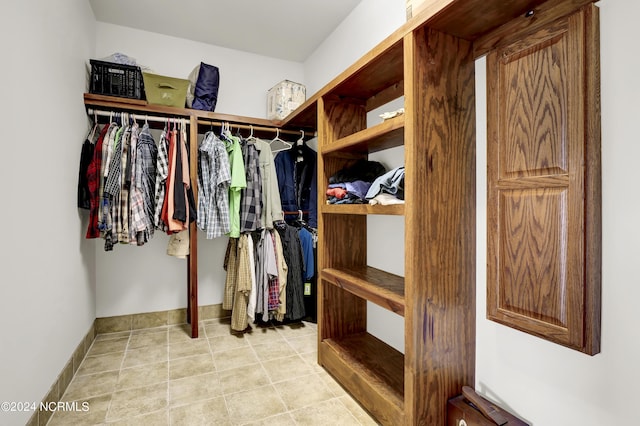 walk in closet featuring light tile patterned floors