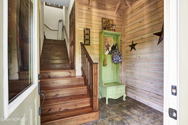 stairs with wood walls