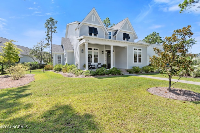 view of front of property featuring a front yard and a porch