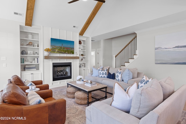 living room with high vaulted ceiling, built in features, ceiling fan, and beam ceiling