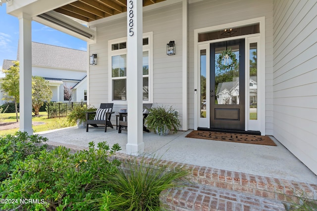 doorway to property with covered porch