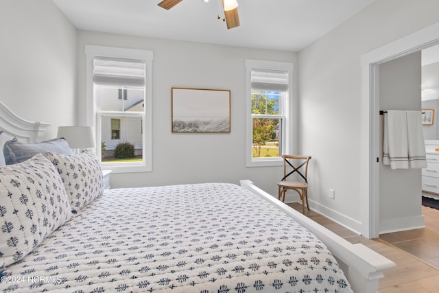 bedroom featuring ceiling fan and light hardwood / wood-style flooring