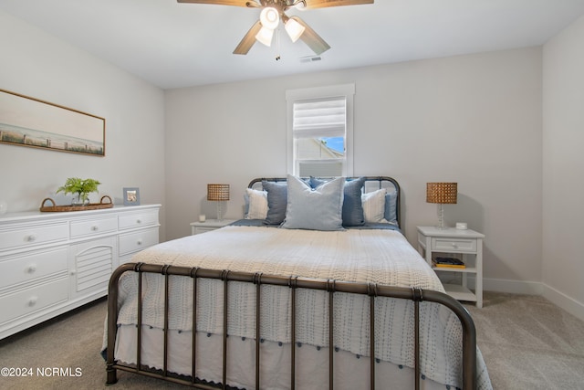 bedroom with ceiling fan and carpet floors