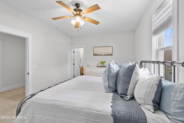 carpeted bedroom featuring ceiling fan