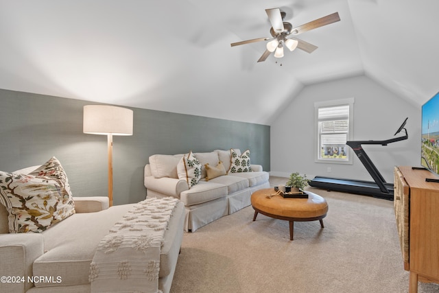 living room with light colored carpet, ceiling fan, and vaulted ceiling