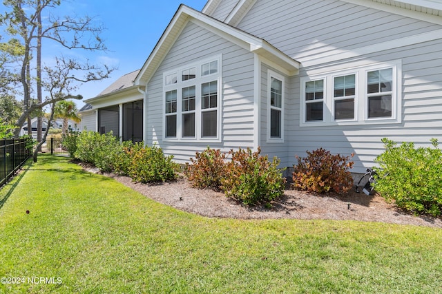 view of property exterior with a lawn