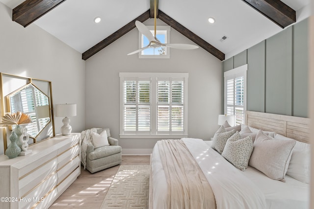 bedroom featuring light wood-type flooring, beamed ceiling, and high vaulted ceiling