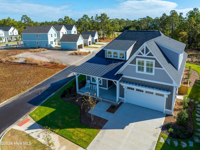 view of front of property featuring a garage and covered porch