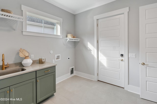 laundry area featuring cabinets, sink, ornamental molding, washer hookup, and hookup for an electric dryer