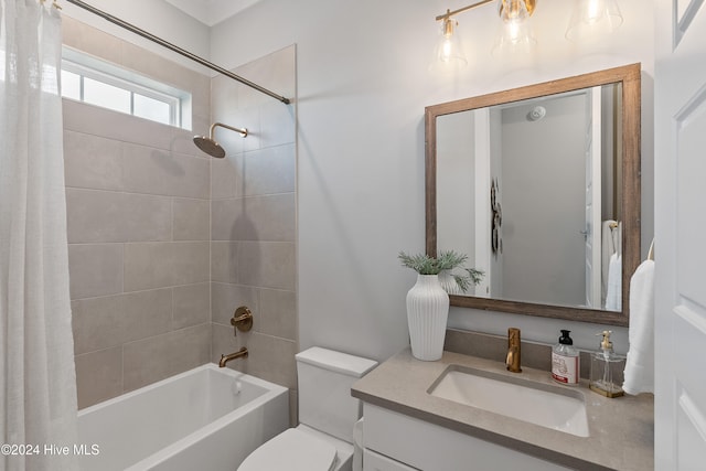 full bathroom featuring toilet, vanity, and shower / bath combo with shower curtain