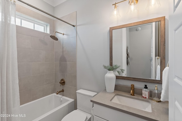 951 Trisail Ter, Wilmington, NC 28412 - bathroom featuring shower / bath combo with shower curtain, vanity, and toilet