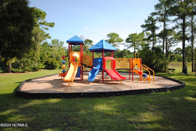 view of playground with a yard