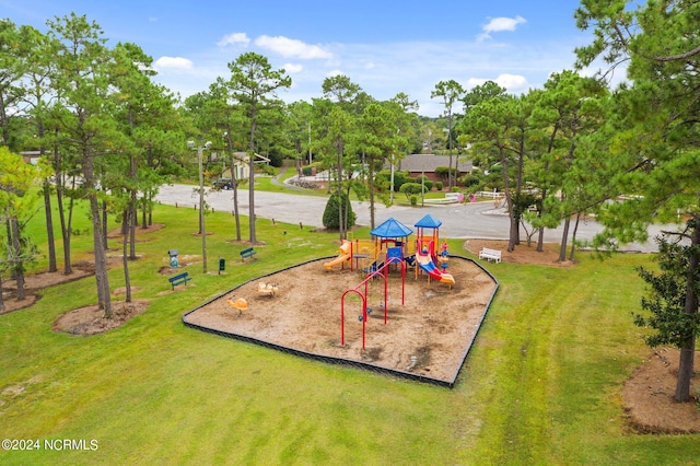 view of jungle gym featuring a lawn