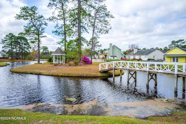 dock area with a gazebo and a water view