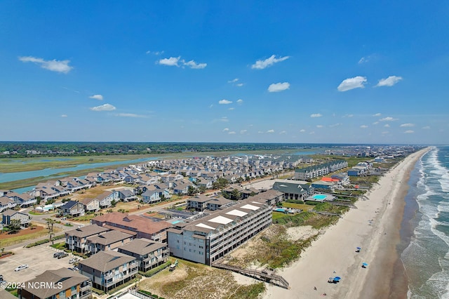 bird's eye view featuring a water view and a view of the beach