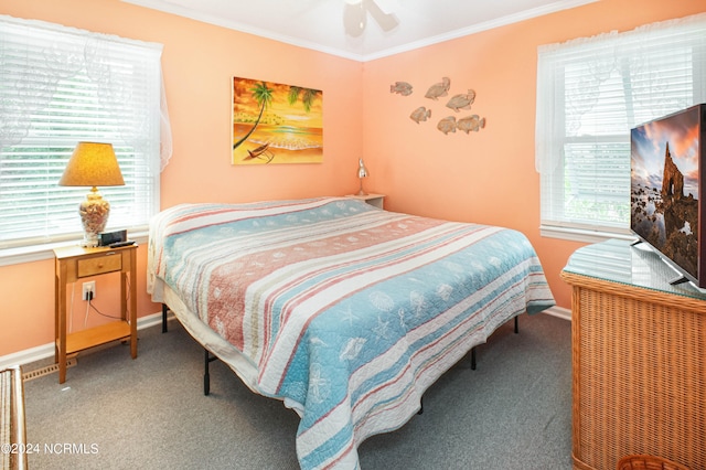 bedroom with ceiling fan, carpet flooring, and crown molding