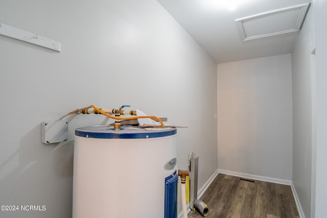 utility room featuring water heater