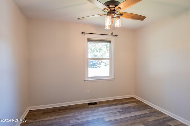 empty room featuring hardwood / wood-style floors and ceiling fan