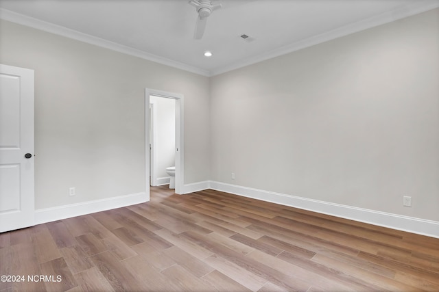 unfurnished room with crown molding, light wood-type flooring, and ceiling fan