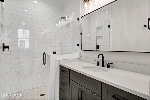 bathroom with vanity and an enclosed shower