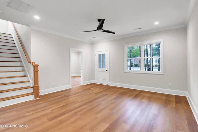 unfurnished living room featuring crown molding, light hardwood / wood-style flooring, and ceiling fan