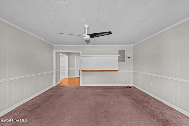 carpeted empty room with ceiling fan and crown molding