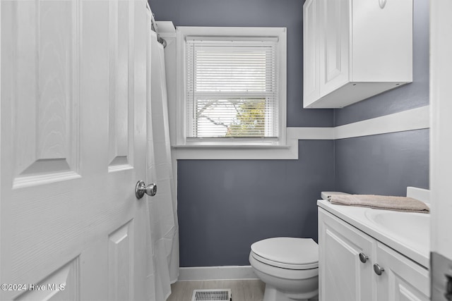 bathroom with vanity and toilet