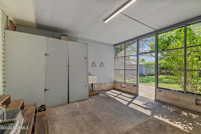 unfurnished sunroom with a wealth of natural light