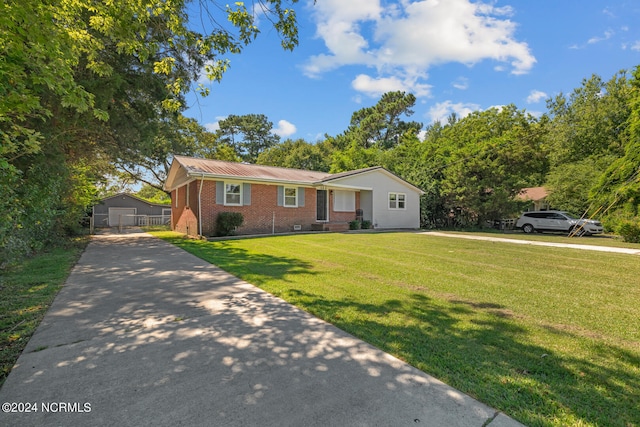 ranch-style house featuring a front lawn