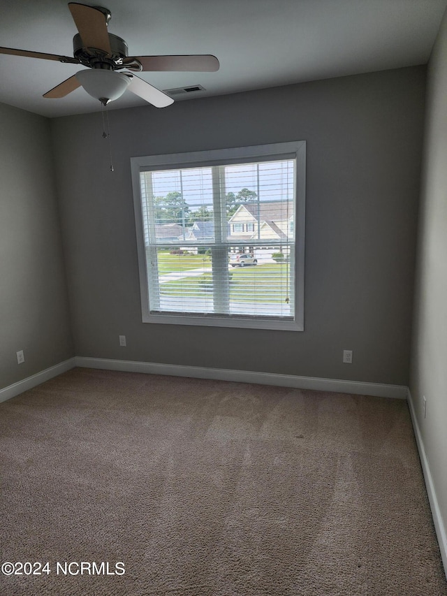 carpeted empty room with ceiling fan